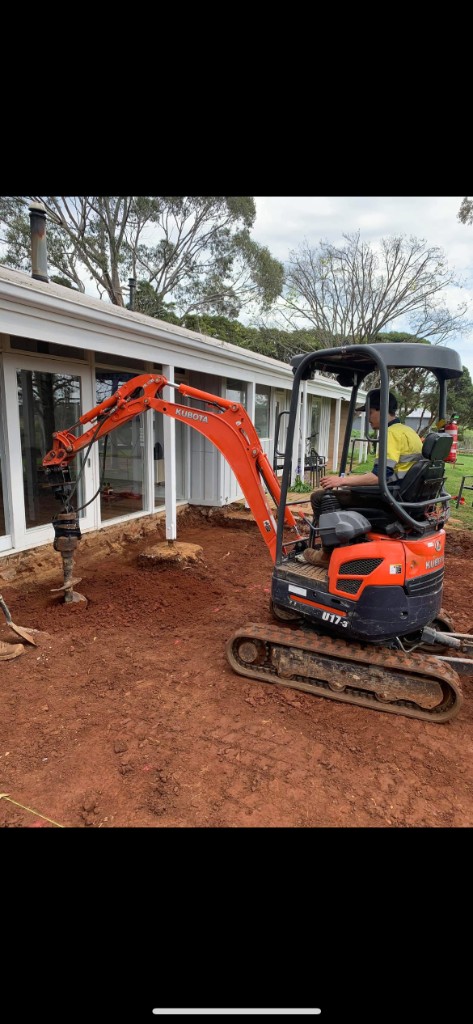 Mini excavator with auger